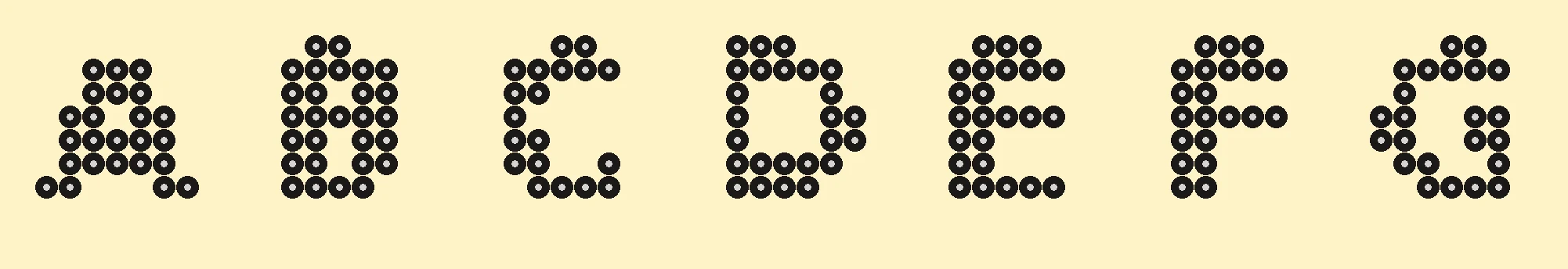 Perler bead alphabet letters A through G laid out on 9x9 pegboard grids